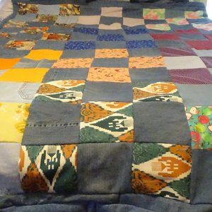 Denim quilt with 100% cotton denim and cotton fabric, measures 55" x 71"